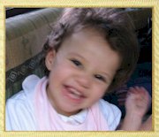 Guess who's this cute girl smiling?  Shes LINDIZ PARAS SANJURJO, 2-year old daughter of Paul Sanjurjo and former Genesis member Pia Paras. Now based in New Jersey, USA, the Sanjurjo family had their Christmas holidays in the Philippines in December 2003.