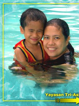 MOTHER & CHILD COVER PHOTO: Olive and MJ Cabauatan posing for a personal family shoot while a beach holiday. Olive is the mother of two boys  CJ and MJ  with loving husband, Percy. (photo taken by Bro. Percy)